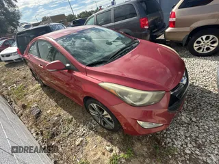 2014 Hyundai Elantra Coupe with VIN KMHDH6AH9EU025573, listed as a Copart auction lot 87049884 with 103,713 mi miles and Clean Title. Bid and sale history available at carsss.com. Image 1.
