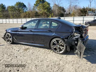 2020 BMW 5 Series M550i xDrive with VIN WBAJS7C0XLCE44248, listed as a Copart auction lot 48660045 with 73,949 mi miles and Salvage title. Bid and sale history available at DreamBid. Image 2.