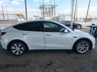 2023 Tesla Model Y Long Range with VIN 7SAYGAEE7PF607195, listed as a IAAI auction lot 41819147 with 74,694 mi miles. Bid and sale history available at carsss.com. Image 13.