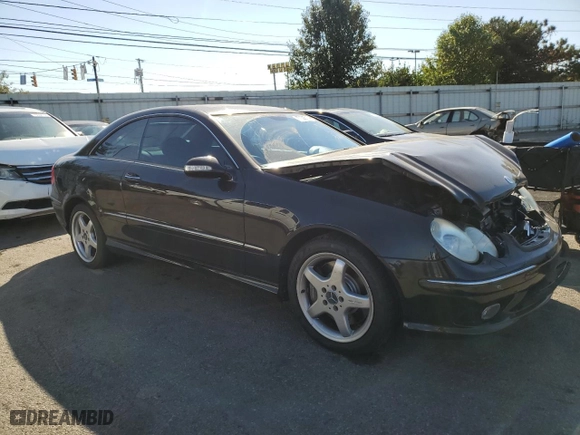 2003 Mercedes-Benz CLK-Class 5.0L with VIN WDBTJ75JX3F039229, listed as a Copart auction lot 77006714 with 111,617 mi miles and Salvage Title. Bid and sale history available at carsss.com. Image 4.