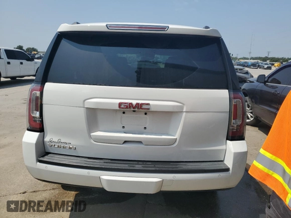 2020 GMC Yukon SLT with VIN 1GKS1BKC0LR243224, listed as a Copart auction lot 65768234 with 129,702 mi miles and Salvage Title. Bid and sale history available at DreamBid. Image 6.