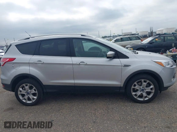 2016 Ford Escape Titanium with VIN 1FMCU9JX3GUC86930, listed as a IAAI auction lot 42582263 with 113,386 mi miles and . Bid and sale history available at DreamBid. Image 13.