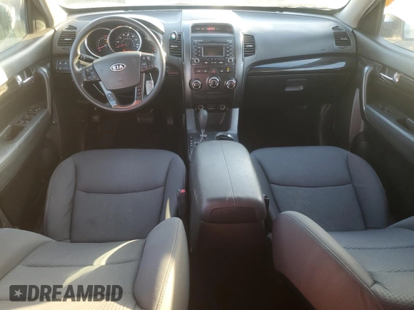2012 Kia Sorento LX with VIN 5XYKTCA62CG255185, listed as a Copart auction lot 87242304 with 124,224 mi miles and Salvage Title. Bid and sale history available at DreamBid. Image 8.