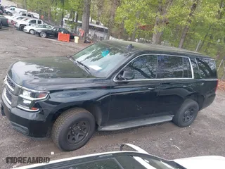 2019 Chevrolet Tahoe Commercial with VIN 1GNLCDECXKR208052, listed as a IAAI auction lot 42014348 with 96,455 mi miles. Bid and sale history available at carsss.com. Image 14.