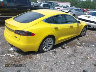2016 Tesla Model S 70 kWh Battery with VIN 5YJSA1E14GF141579, listed as a IAAI auction lot 42209119 with 105,947 mi miles and . Bid and sale history available at carsss.com. Image 4.