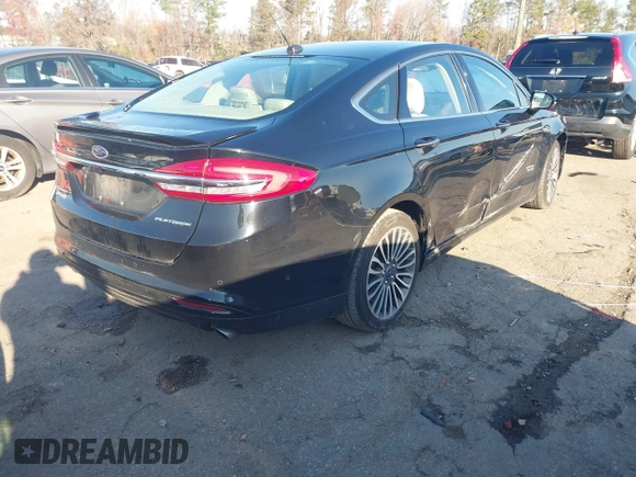 2017 Ford Fusion Titanium with VIN 3FA6P0SU2HR309895, listed as a IAAI auction lot 40963527 with 80,761 mi miles and . Bid and sale history available at DreamBid. Image 4.