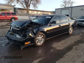2005 Cadillac DeVille with VIN 1G6KD54Y45U165109, listed as a Copart auction lot 84695674 with 92,569 mi miles and Salvage Title. Bid and sale history available at carsss.com. Image 1.