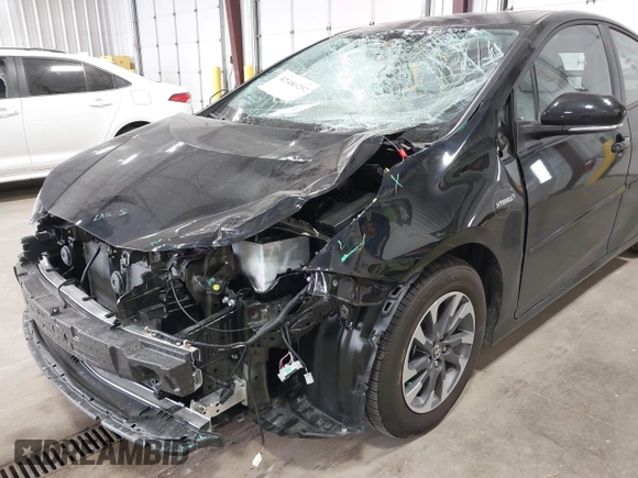 2022 Toyota Prius L Eco with VIN JTDKAMFU2N3186072, listed as a IAAI auction lot 42486252 with 5,887 mi miles and . Bid and sale history available at DreamBid. Image 6.