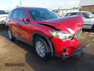 2015 Mazda CX-5 Sport z VIN JM3KE2BE7F0516869, wystawiony jako IAAI lot #41866488 z przebiegiem 131 237 mil mil oraz . Historia ofert i sprzedaży dostępna na DreamBid. Obrazek 1.