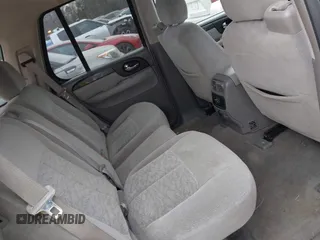 2005 GMC Envoy SLT with VIN 1GKDT13S452263166, listed as a IAAI auction lot 41543466 with 166,999 mi miles. Bid and sale history available at carsss.com. Image 8.