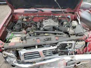 1993 Nissan Hardbody z VIN 1N6HD16S0PC319877, wystawiony jako Copart lot #50015745 z przebiegiem 162 441 mil mil oraz Szkoda całkowita • Salvage title. Historia ofert i sprzedaży dostępna na DreamBid. Obrazek 11.