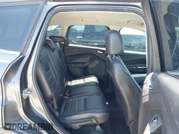 2017 Ford Escape Titanium with VIN 1FMCU0J97HUE07747, listed as a IAAI auction lot 41977788 with 104,560 mi miles. Bid and sale history available at carsss.com. Image 8.