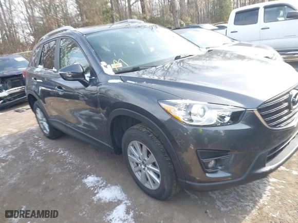 2016 Mazda CX-5 Touring with VIN JM3KE2CY6G0910986, listed as a IAAI auction lot 41619401 with NaN miles. Bid and sale history available at carsss.com. Image 1.