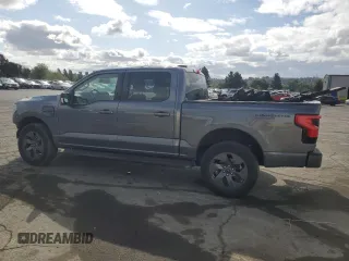 2023 Ford F-150 Lightning Pro with VIN 1FT6W1EV0PWG34788, listed as a Copart auction lot 54454805 with 11,432 mi miles and Salvage title. Bid and sale history available at DreamBid. Image 2.