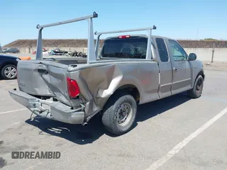 2002 Ford F-150 XL with VIN 1FTRX17272KE07014, listed as a IAAI auction lot 42381725 with 212,294 mi miles and . Bid and sale history available at DreamBid. Image 4.