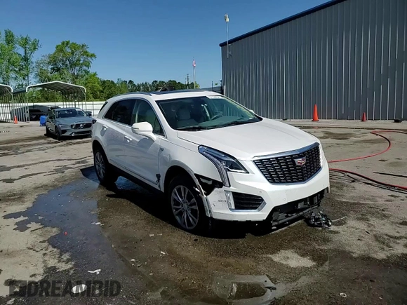 2021 Cadillac XT5 FWD Premium Luxury z VIN 1GYKNCRS2MZ209820, wystawiony jako Copart lot #51332565 z przebiegiem 52 916 mil mil oraz Szkoda całkowita • Salvage title. Historia ofert i sprzedaży dostępna na DreamBid. Obrazek 13.