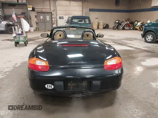1999 Porsche Boxster z VIN WP0CA2984XU622814, wystawiony jako IAAI lot #42234977 z przebiegiem 52 404 mil mil oraz . Historia ofert i sprzedaży dostępna na DreamBid. Obrazek 15.