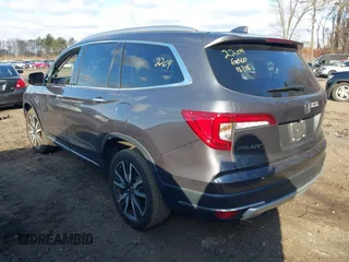 2022 Honda Pilot Touring 7-Passenger with VIN 5FNYF6H62NB010647, listed as a IAAI auction lot 41199560 with 102,066 mi miles. Bid and sale history available at carsss.com. Image 3.