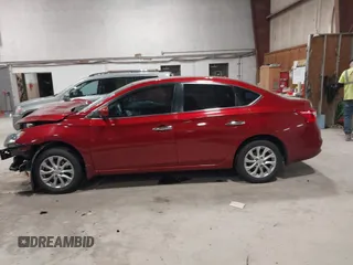 2019 Nissan Sentra S z VIN 3N1AB7AP7KY257283, wystawiony jako IAAI lot #42012338 z przebiegiem 103 503 mil mil oraz . Historia ofert i sprzedaży dostępna na DreamBid. Obrazek 15.