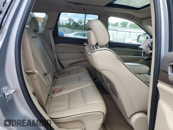 2015 Jeep Grand Cherokee Overland with VIN 1C4RJFCG3FC880084, listed as a Copart auction lot 57291165 with 112,442 mi miles and Salvage title. Bid and sale history available at DreamBid. Image 11.