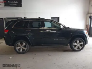 2014 Jeep Grand Cherokee Overland with VIN 1C4RJFCM4EC386398, listed as a IAAI auction lot 41696113 with 119,110 mi miles. Bid and sale history available at carsss.com. Image 13.