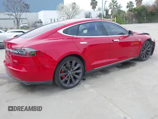 2015 Tesla Model S 85D with VIN 5YJSA1H42FF086599, listed as a IAAI auction lot 41832223 with 67,671 mi miles. Bid and sale history available at carsss.com. Image 4.