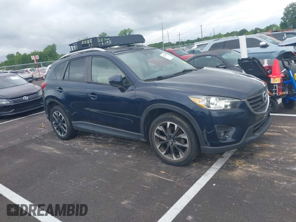 2016 Mazda CX-5 Grand Touring with VIN JM3KE2DYXG0890174, listed as a IAAI auction lot 42157884 with 141,873 mi miles. Bid and sale history available at carsss.com. Image 13.
