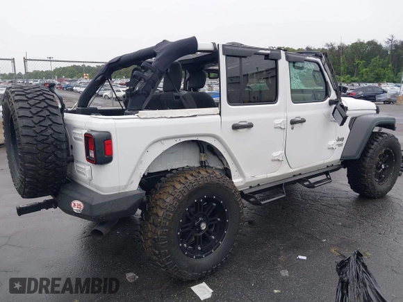 2018 Jeep Wrangler Unlimited Sport with VIN 1C4HJXDG0JW233696, listed as a IAAI auction lot 42523474 with 66,961 mi miles and . Bid and sale history available at DreamBid. Image 4.