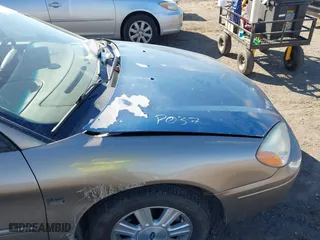 2005 Ford Taurus SEL with VIN 1FAFP56S05A158275, listed as a IAAI auction lot 41869232 with 136,477 mi miles. Bid and sale history available at carsss.com. Image 6.