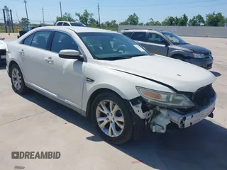 2011 Ford Taurus SEL z VIN 1FAHP2HW7BG148004, wystawiony jako IAAI lot #42245047 z przebiegiem 102 999 mil mil oraz . Historia ofert i sprzedaży dostępna na DreamBid. Obrazek 1.