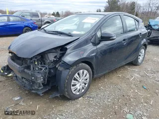2016 Toyota Prius c One with VIN JTDKDTB33G1137640, listed as a IAAI auction lot 41729098 with 165,366 mi miles. Bid and sale history available at carsss.com. Image 2.