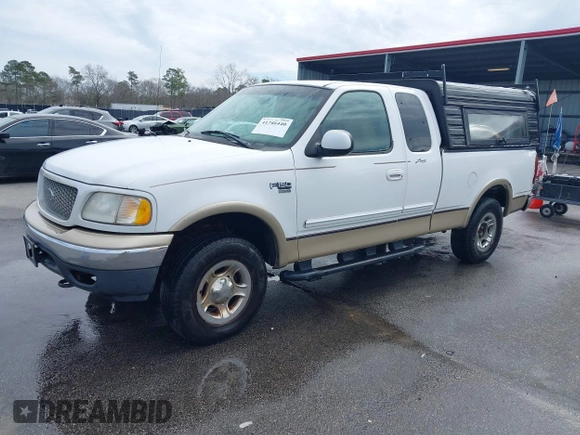 1999 Ford F-150 XL with VIN 1FTRX18LXXNA16159, listed as a IAAI auction lot 41746440 with 999,999 mi miles. Bid and sale history available at carsss.com. Image 2.