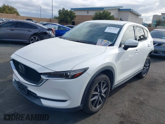 2018 Mazda CX-5 Grand Touring with VIN JM3KFADMXJ0470846, listed as a IAAI auction lot 41913533 with 54,700 mi miles and . Bid and sale history available at DreamBid. Image 18.