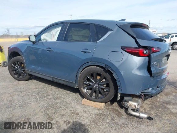 2023 Mazda CX-5 2.5 S Carbon Edition with VIN JM3KFBCM9P0240506, listed as a IAAI auction lot 41583703 with 23,173 mi miles. Bid and sale history available at carsss.com. Image 3.