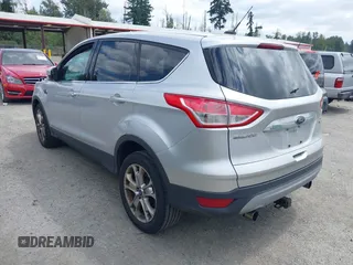 2013 Ford Escape SEL with VIN 1FMCU0HX5DUB53695, listed as a IAAI auction lot 42795881 with 165,330 mi miles and . Bid and sale history available at DreamBid. Image 3.