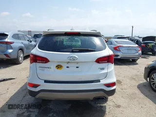 2018 Hyundai Santa Fe 2.4L z VIN 5NMZUDLB3JH055771, wystawiony jako IAAI lot #42126058 z przebiegiem 142 991 mil mil oraz . Historia ofert i sprzedaży dostępna na DreamBid. Obrazek 16.