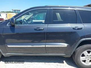 2012 Jeep Grand Cherokee Laredo with VIN 1C4RJEAG9CC223167, listed as a IAAI auction lot 42136098 with 152,715 mi miles. Bid and sale history available at carsss.com. Image 14.