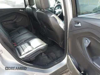 2015 Ford Escape Titanium z VIN 1FMCU0J91FUC41531, wystawiony jako IAAI lot #41903203 z przebiegiem 118 962 mil mil oraz . Historia ofert i sprzedaży dostępna na DreamBid. Obrazek 8.