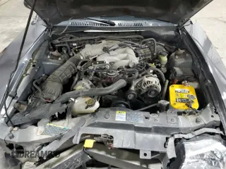 2003 Ford Mustang Deluxe z VIN 1FAFP44433F369534, wystawiony jako Copart lot #76606794 z przebiegiem 88 503 mil mil oraz Szkoda całkowita • Salvage title. Historia ofert i sprzedaży dostępna na DreamBid. Obrazek 11.