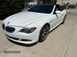 2009 BMW 6 Series 650i with VIN WBAEB53599C224302, listed as a Copart auction lot 55150865 with 123,706 mi miles and Salvage Title. Bid and sale history available at carsss.com. Image 1.