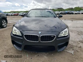 2016 BMW M6 z VIN WBS6G9C58GD931908, wystawiony jako Copart lot #72067214 z przebiegiem 84 170 mil mil oraz Szkody całkowita. Historia ofert i sprzedaży dostępna na DreamBid. Obrazek 5.