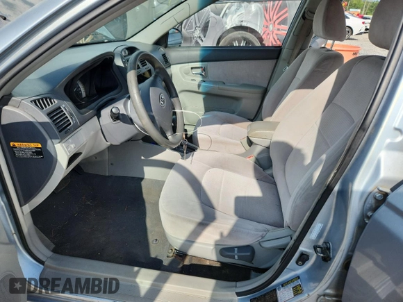 2007 Kia Spectra EX with VIN KNAFE121075394066, listed as a Copart auction lot 63238165 with 234,287 mi miles and Salvage title. Bid and sale history available at DreamBid. Image 7.