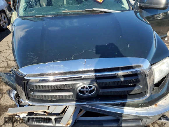 2013 Toyota Tundra z VIN 5TFUY5F12DX288608, wystawiony jako Copart lot #86147124 z przebiegiem Nie podano mil oraz Szkoda całkowita • Salvage title. Historia ofert i sprzedaży dostępna na DreamBid. Obrazek 11.