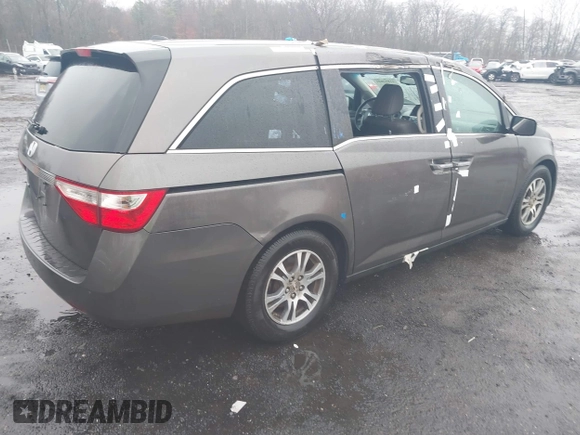 2012 Honda Odyssey EX-L with VIN 5FNRL5H64CB037689, listed as a IAAI auction lot 41857822 with 121,601 mi miles and . Bid and sale history available at carsss.com. Image 4.