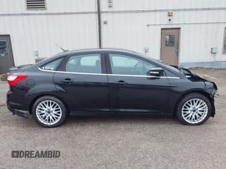 2014 Ford Focus Titanium with VIN 1FADP3J25EL310199, listed as a IAAI auction lot 40682901 with 84,885 mi miles and . Bid and sale history available at DreamBid. Image 15.