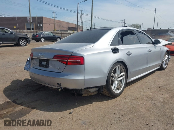 2016 Audi A8 Sport z VIN WAU43AFD0GN011518, wystawiony jako IAAI lot #42096343 z przebiegiem Nie podano mil oraz . Historia ofert i sprzedaży dostępna na DreamBid. Obrazek 4.