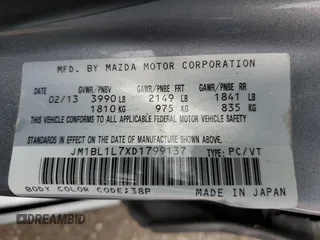 2013 Mazda 3 i Touring z VIN JM1BL1L7XD1799137, wystawiony jako Copart lot #52456445 z przebiegiem 175 319 mil mil oraz Szkoda całkowita • Salvage title. Historia ofert i sprzedaży dostępna na DreamBid. Obrazek 12.