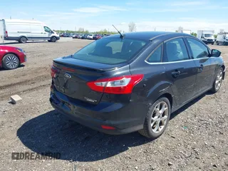 2013 Ford Focus Titanium with VIN 1FADP3J22DL106166, listed as a IAAI auction lot 42233351 with 108,300 mi miles and . Bid and sale history available at carsss.com. Image 4.