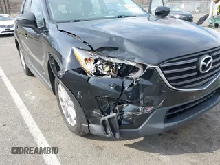2016 Mazda CX-5 Sport with VIN JM3KE4BY7G0893578, listed as a IAAI auction lot 41853840 with 95,937 mi miles. Bid and sale history available at carsss.com. Image 6.