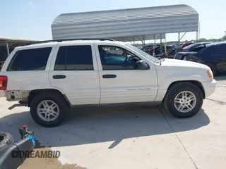 2003 Jeep Grand Cherokee Laredo with VIN 1J4GX48S43C518584, listed as a IAAI auction lot 42213094 with 163,743 mi miles and . Bid and sale history available at DreamBid. Image 14.